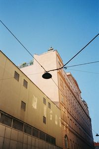 Low angle view of building against blue sky