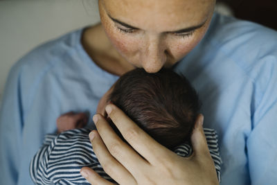 Mother kissing baby boy