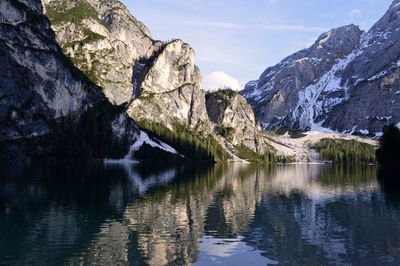 Scenic view of lake and mountains against sky