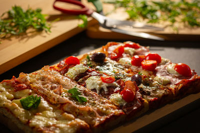 Close-up of pizza served on table