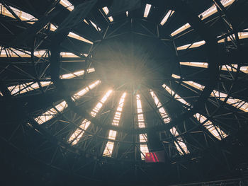 Low angle view of illuminated ferris wheel against sky