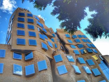 Low angle view of building against blue sky