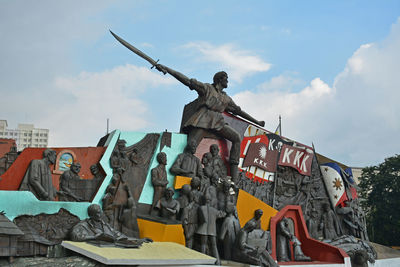 Low angle view of statue against sky