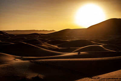 Sahara landscape at sunset, morocco, africa.light and shadows,mythical arabic desert gold sand dunes