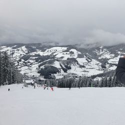 High angle view of people skiing on snowcapped mountains