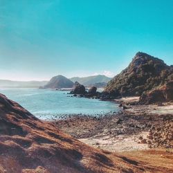 Scenic view of sea against clear blue sky