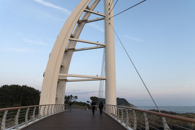 Bridge over sea against sky