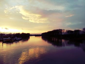 Scenic view of lake at sunset