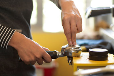 Midsection of man working with ice cream