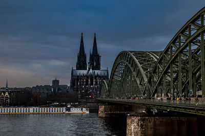 Bridge over river with buildings in background