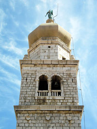 Low angle view of statue against sky