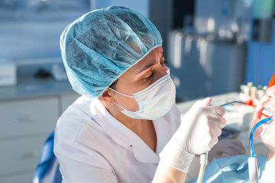 Dentist examining patient