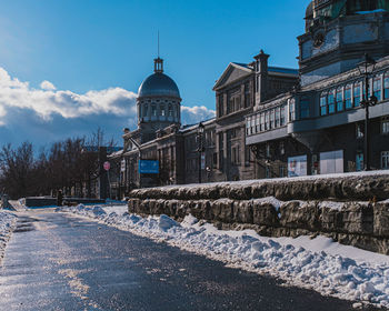 Buildings in city against sky
