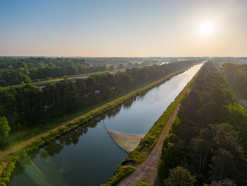 High angle view of bridge over river against sky during sunset