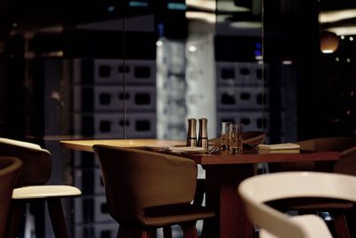 Empty chairs and tables in restaurant