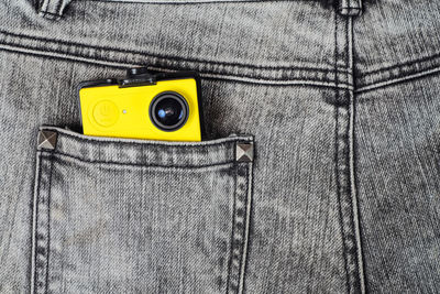 Close-up of yellow camera