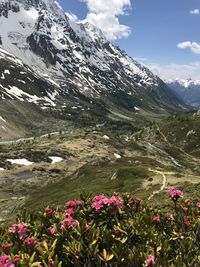 Scenic view of snow covered mountains against sky