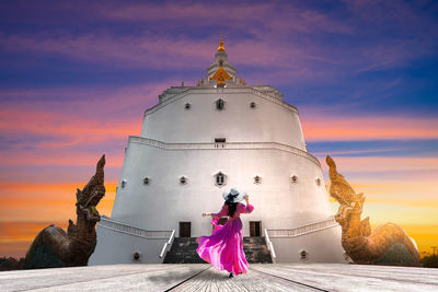 Asian women visit kosapanyo pagoda in plapak nakhon phanom province,thailand.