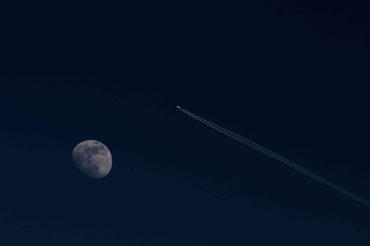 LOW ANGLE VIEW OF MOON IN SKY