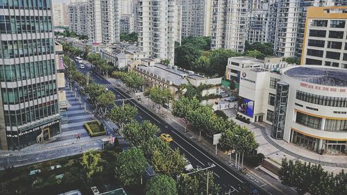 High angle view of street amidst buildings in city