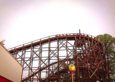 Low angle view of ferris wheel against sky