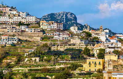 Buildings in city against sky