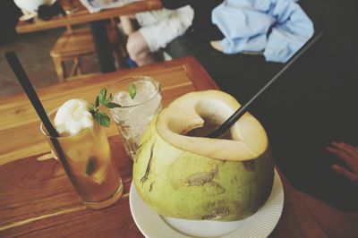 High angle view of coconut water on table