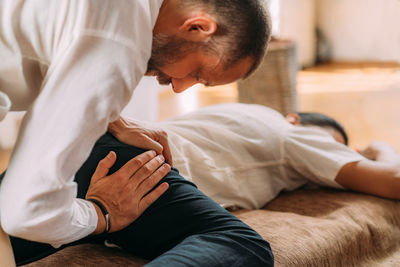 Therapist stretching womans leg. shiatsu massage.