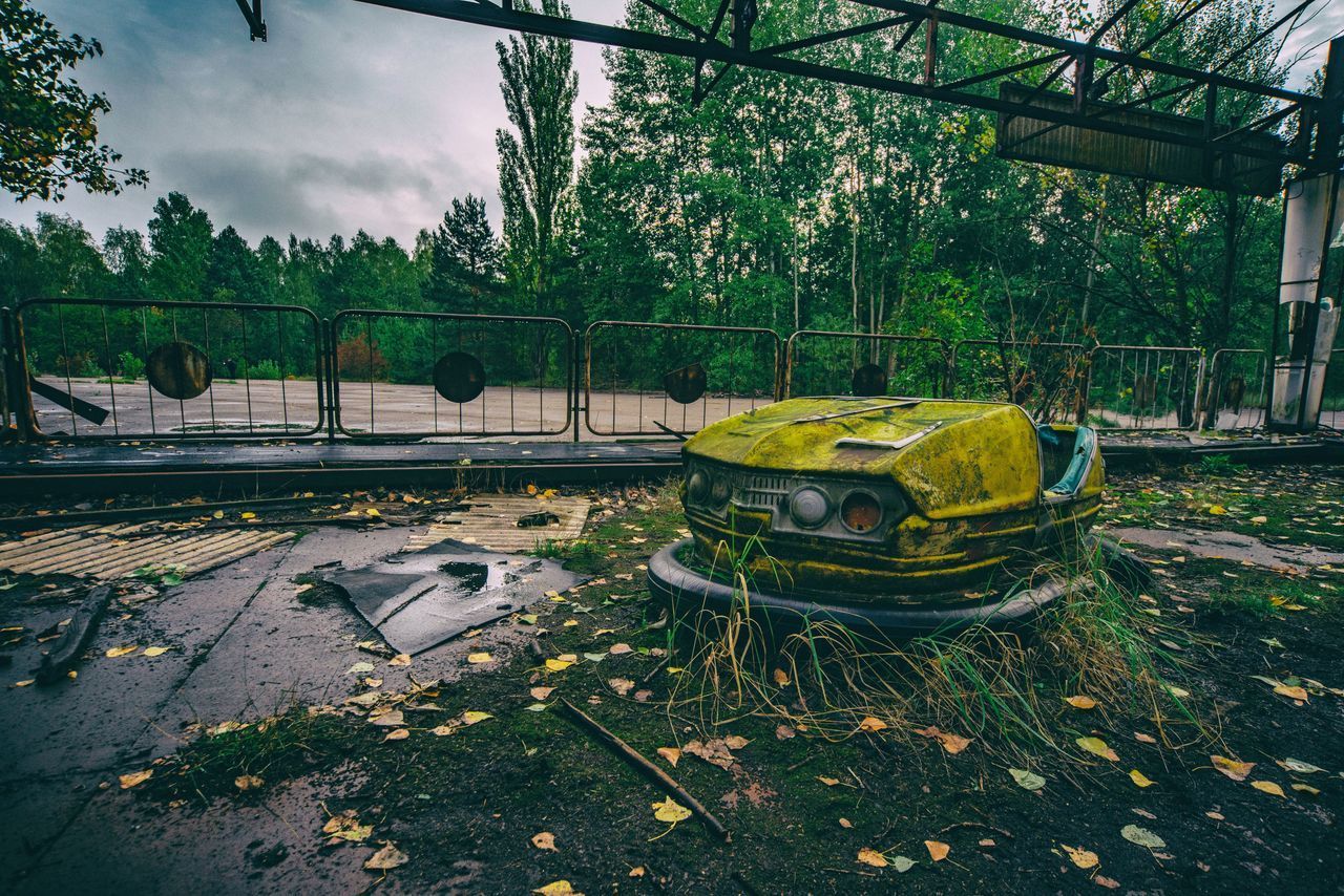 ABANDONED CAR ON FIELD