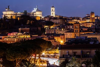 Illuminated buildings in city at night