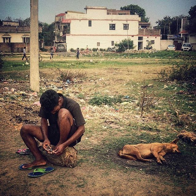 sitting, lifestyles, men, building exterior, relaxation, built structure, leisure activity, togetherness, architecture, full length, lying down, resting, person, rear view, day, bonding, casual clothing