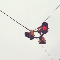 Low angle view of red cables