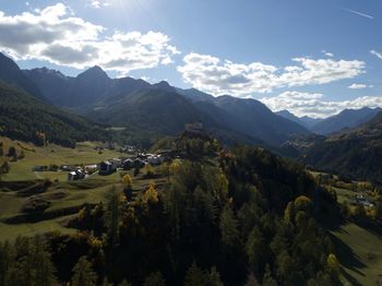 Scenic view of landscape and mountains against sky