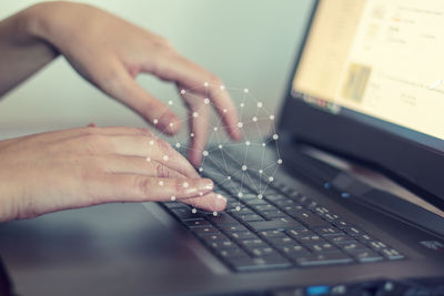 Midsection of woman using mobile phone
