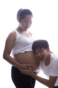 Portrait of a smiling man on woman over white background