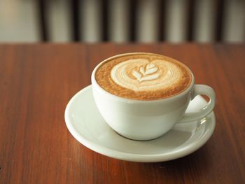 Close-up of cappuccino on table