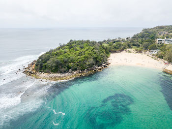 High angle view of swimming pool by sea against sky