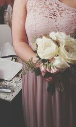 Woman holding flower bouquet