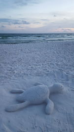 Scenic view of sea against sky during winter