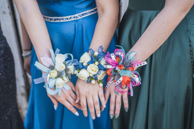 Midsection of woman holding bouquet