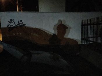 Silhouette of woman sitting in the dark