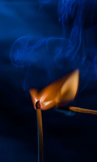 Close-up of burning candle