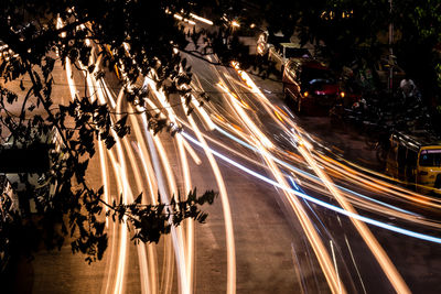 Light trails on road in city at night