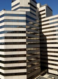 Low angle view of modern buildings against clear sky