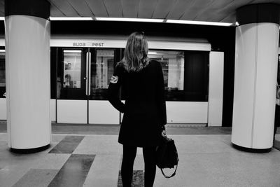 Full length of woman walking in corridor