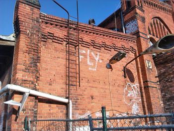 View of houses against blue sky