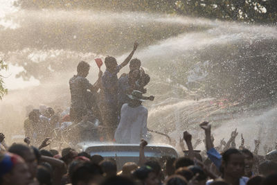 People enjoying in city during water festival