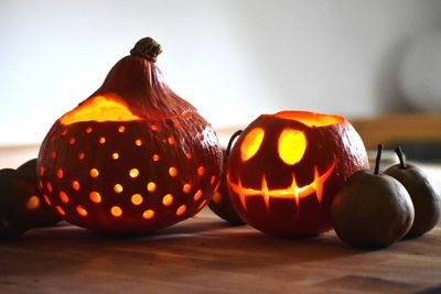 Close-up of illuminated pumpkin on table