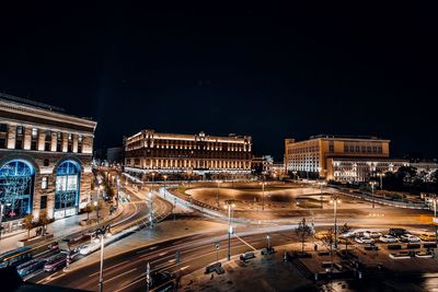 High angle view of city lit up at night