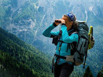 Woman looking through binoculars